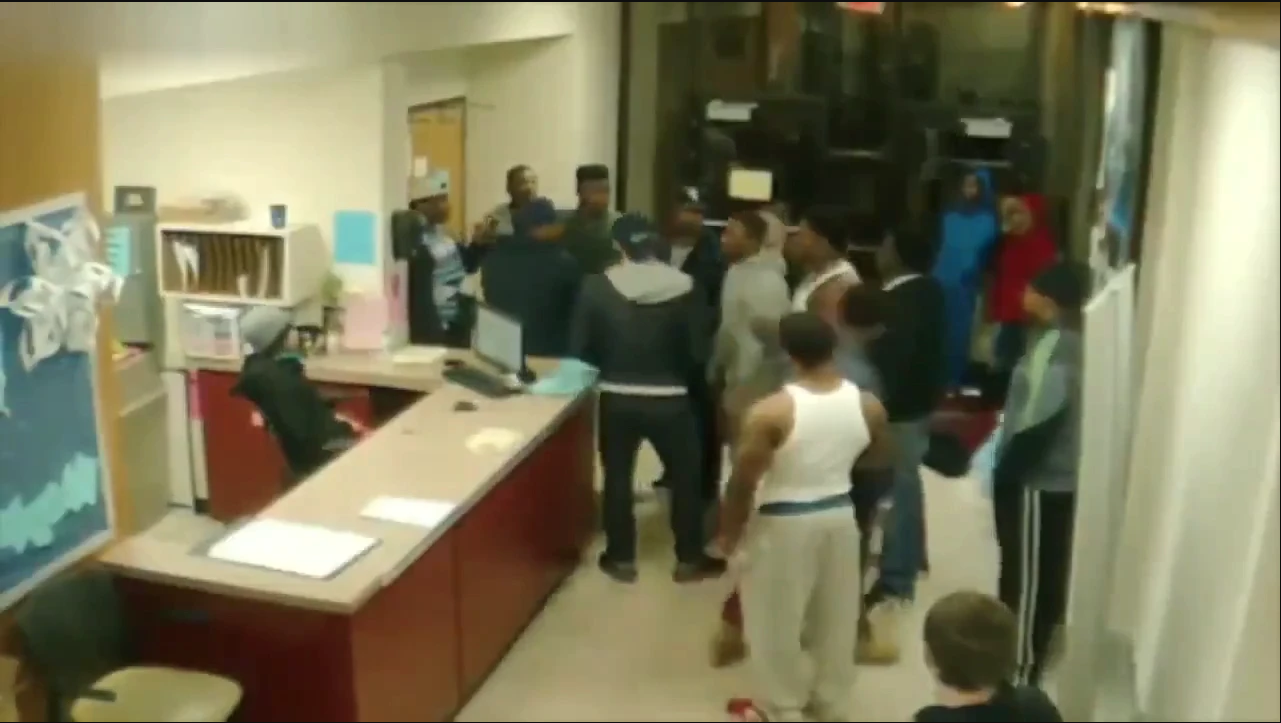 Heavy weight Black Male Sucker Punches White Male in Government building waiting area
